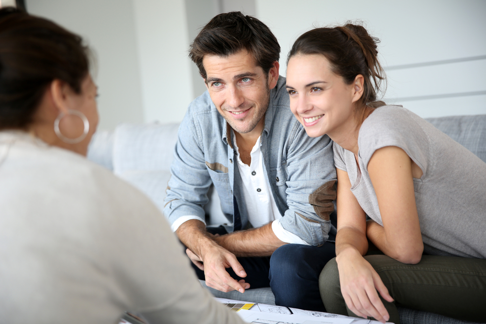 Couple meeting architect for house construction-1